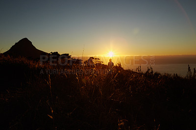 Buy stock photo A beautiful view of a golden sunset from a hilltop 
