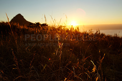 Buy stock photo A beautiful view of a golden sunset from a hilltop 