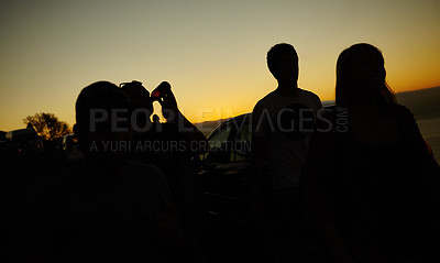 Buy stock photo Silhouette of a group of friends against a yellow sunset