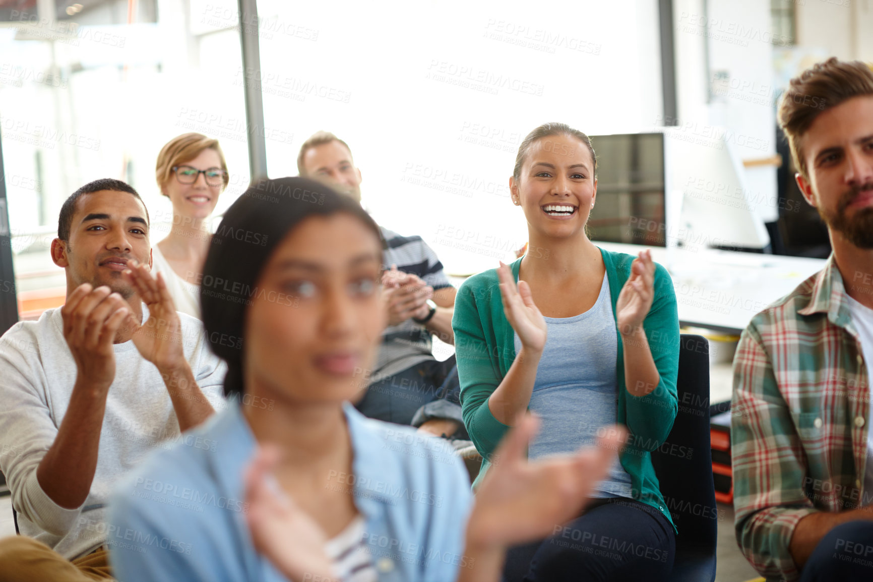 Buy stock photo Shot of a group of young designers applauding a work presentation