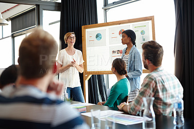 Buy stock photo Cropped shot of businessmen and businesswoman in a meeting