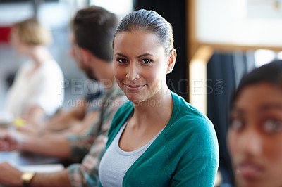 Buy stock photo Portrait of a female designer in a meeting with her colleagues