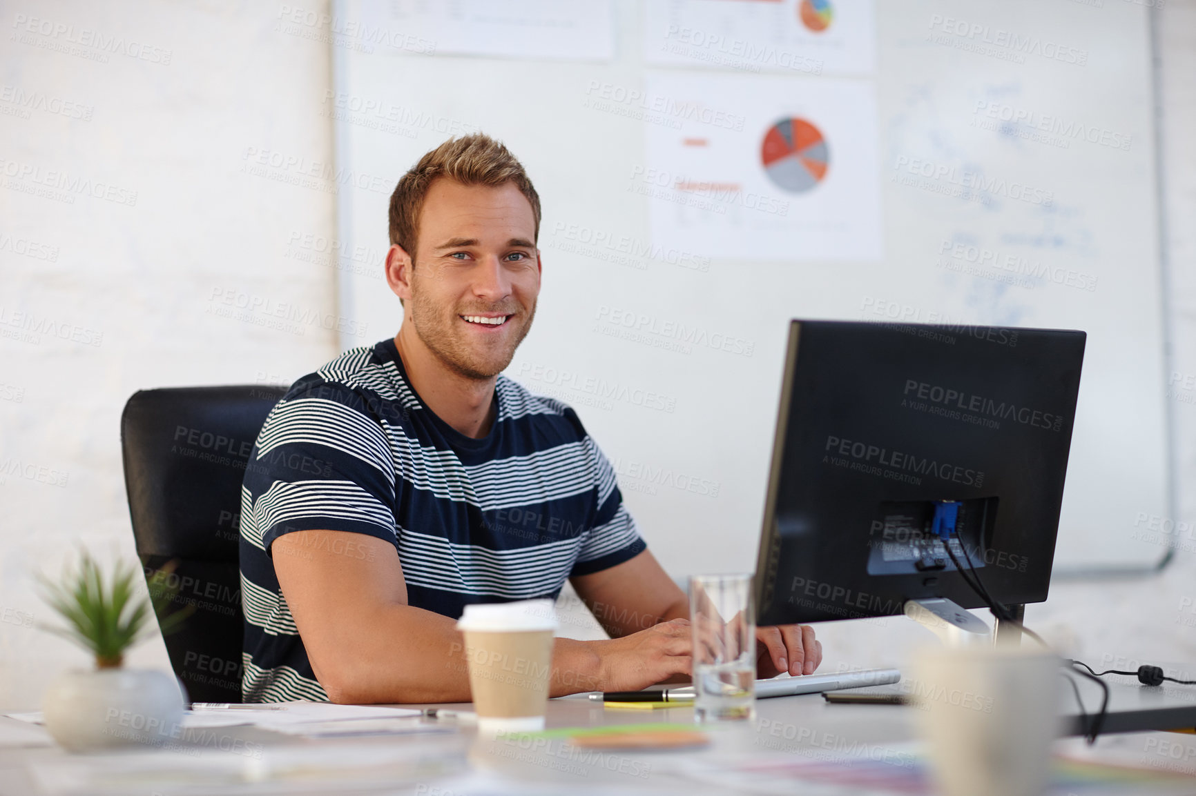 Buy stock photo Portrait of a young male designer working at his computer
