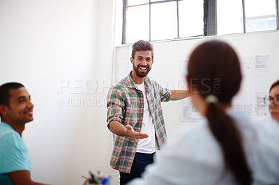 Buy stock photo Shot of a team of young designers in a brainstorming session