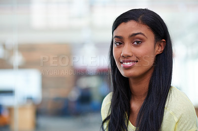Buy stock photo Shot of an attractive designer standing in a large office