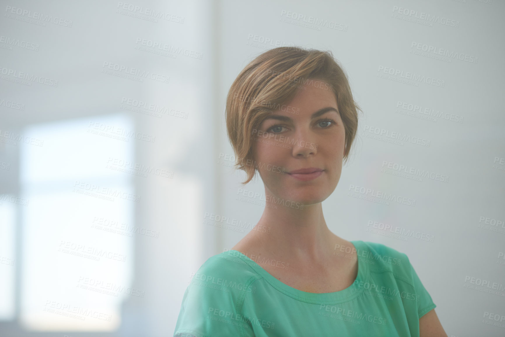 Buy stock photo Shot of an attractive designer standing in a large office