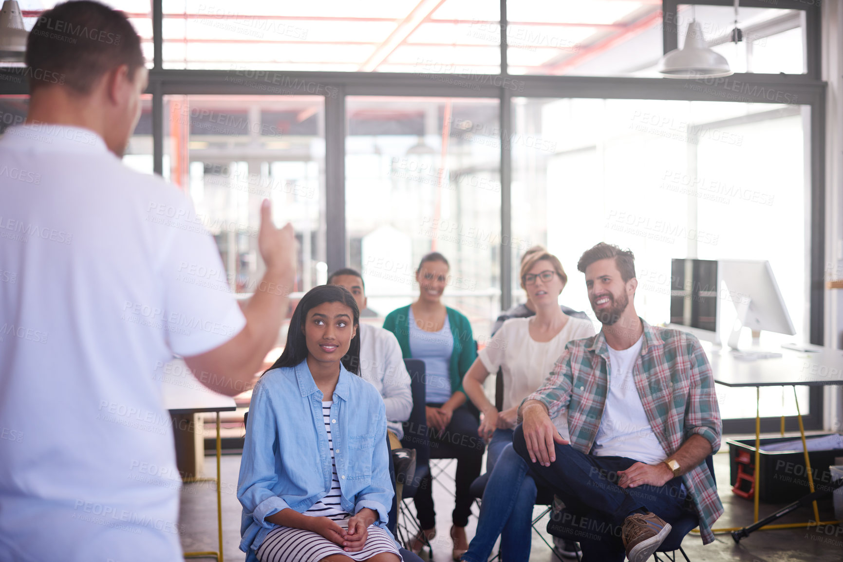 Buy stock photo Man, presentation and back with crowd in office at startup with feedback, review and training at media company. Person, speaker and audience in boardroom, info and announcement at creative agency