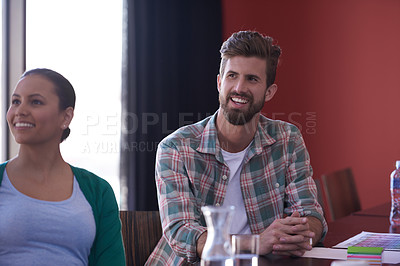 Buy stock photo A group of informal businesspeople in a meeting