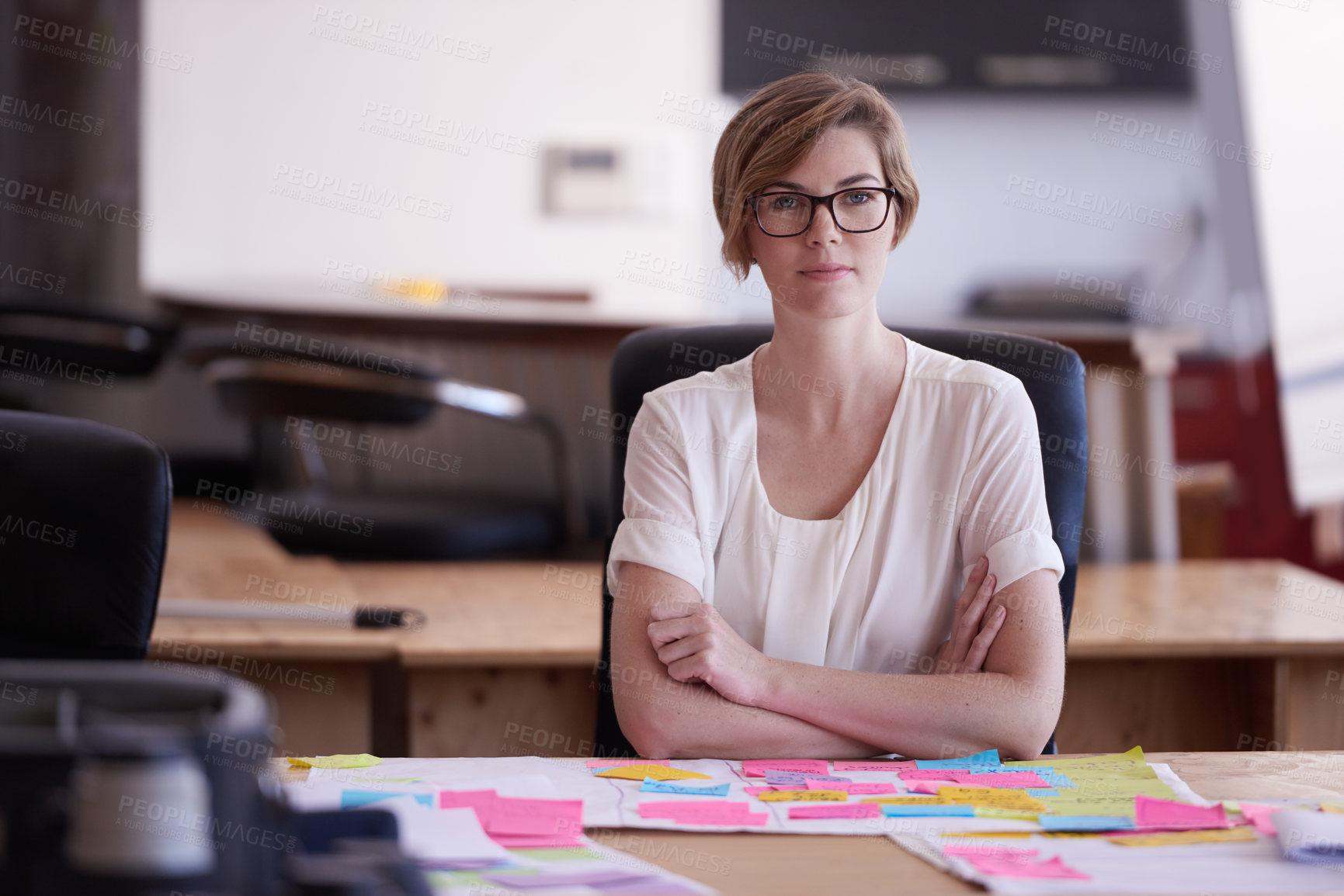 Buy stock photo Woman, arms crossed and portrait with notes at startup for planning, confidence and pride in modern office. Person, writer and documents for mind map, process and review at creative agency in Spain