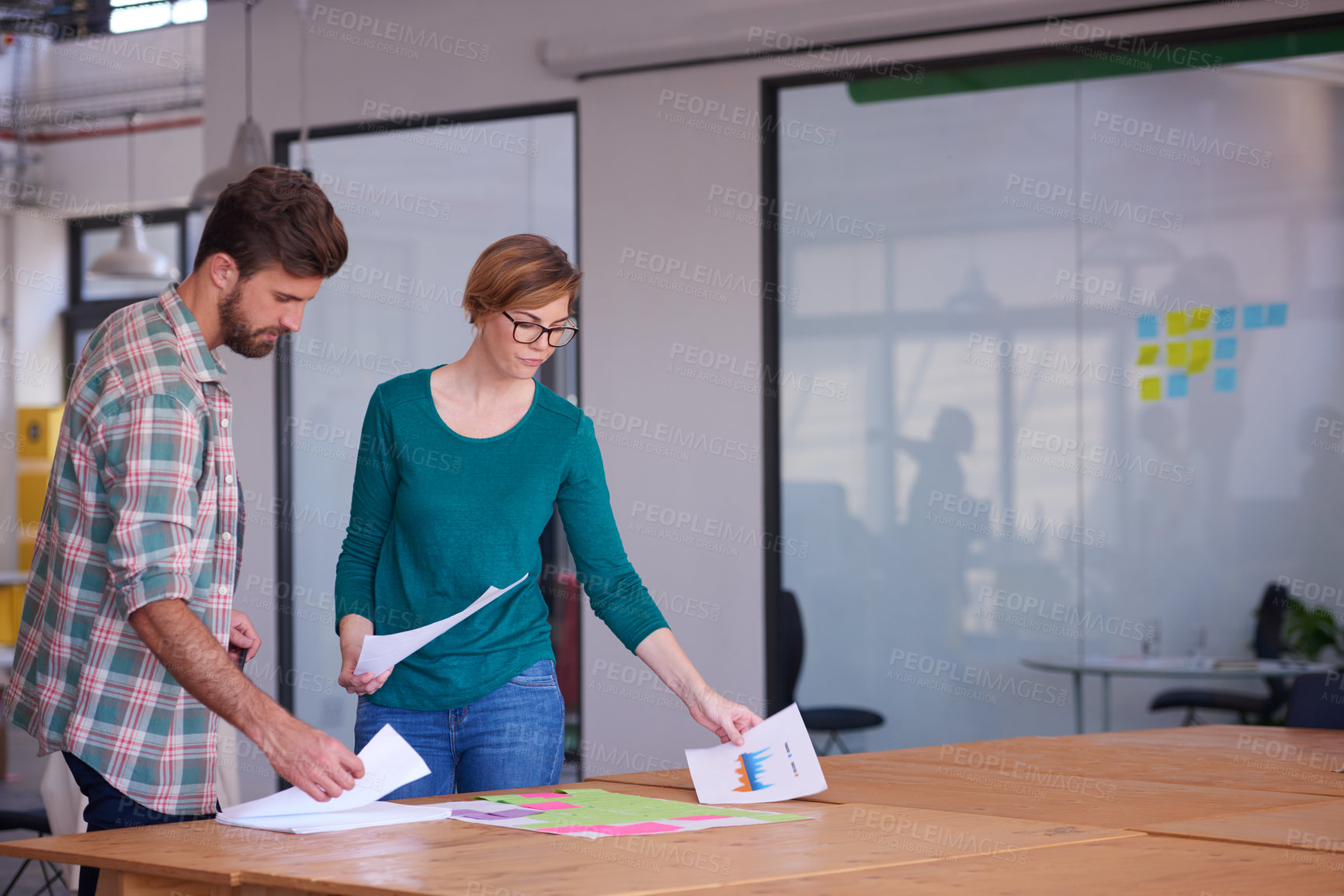 Buy stock photo Man, woman and creative workshop with paperwork for meeting, discussion and project collaboration in office. Notes, data and business people with research ideas, teamwork or planning at design agency