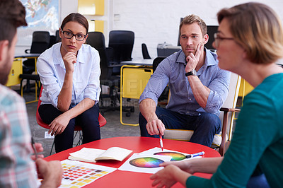 Buy stock photo A group of informal businesspeople in a meeting