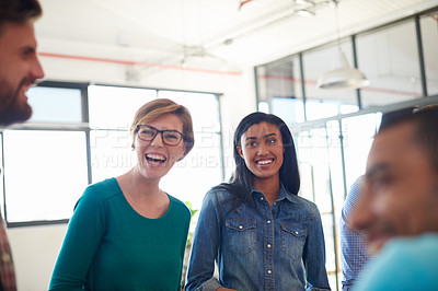 Buy stock photo A group of informal businesspeople in a meeting