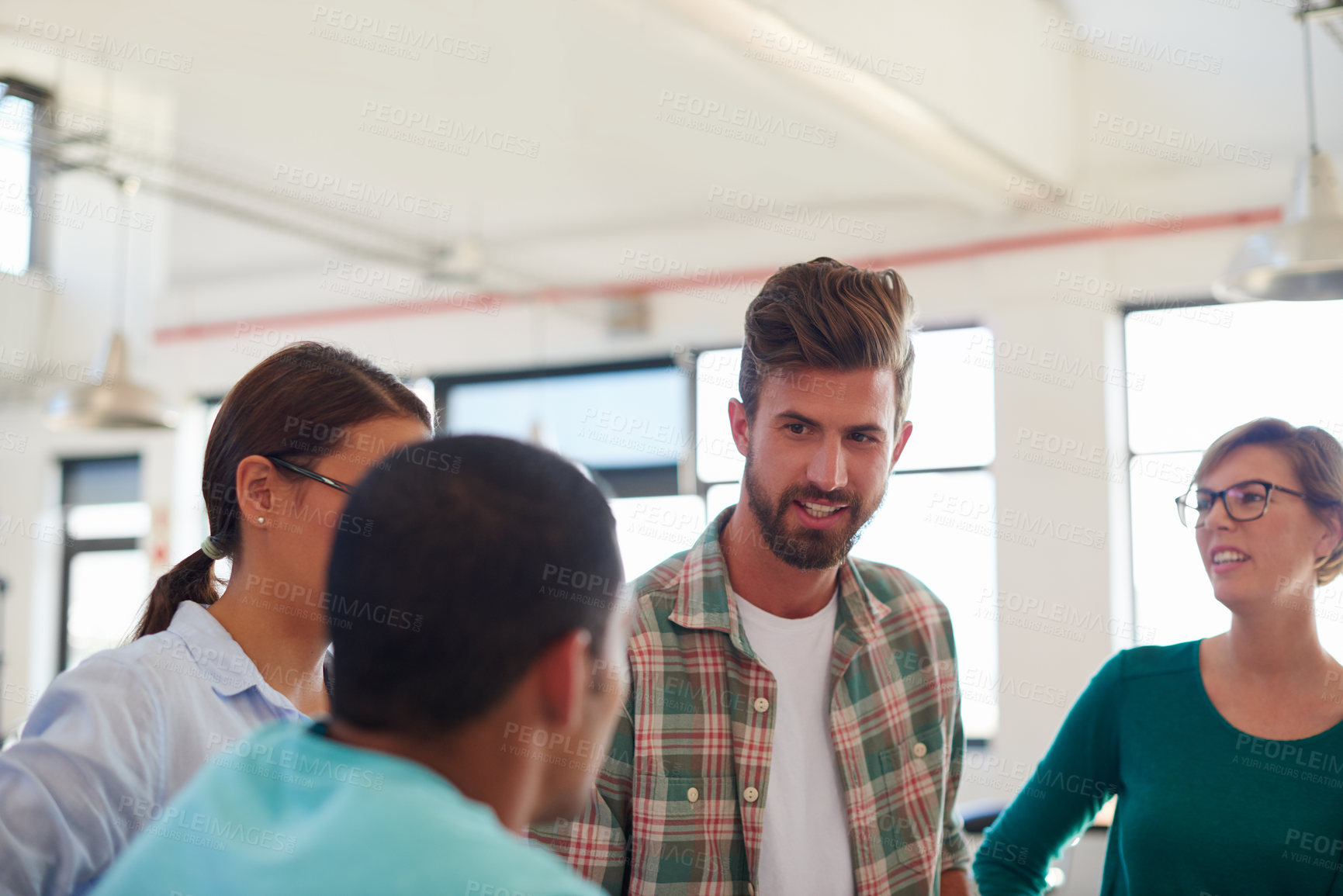 Buy stock photo A group of informal businesspeople in a meeting