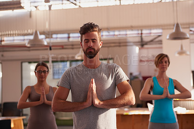 Buy stock photo A group of people doing yoga together