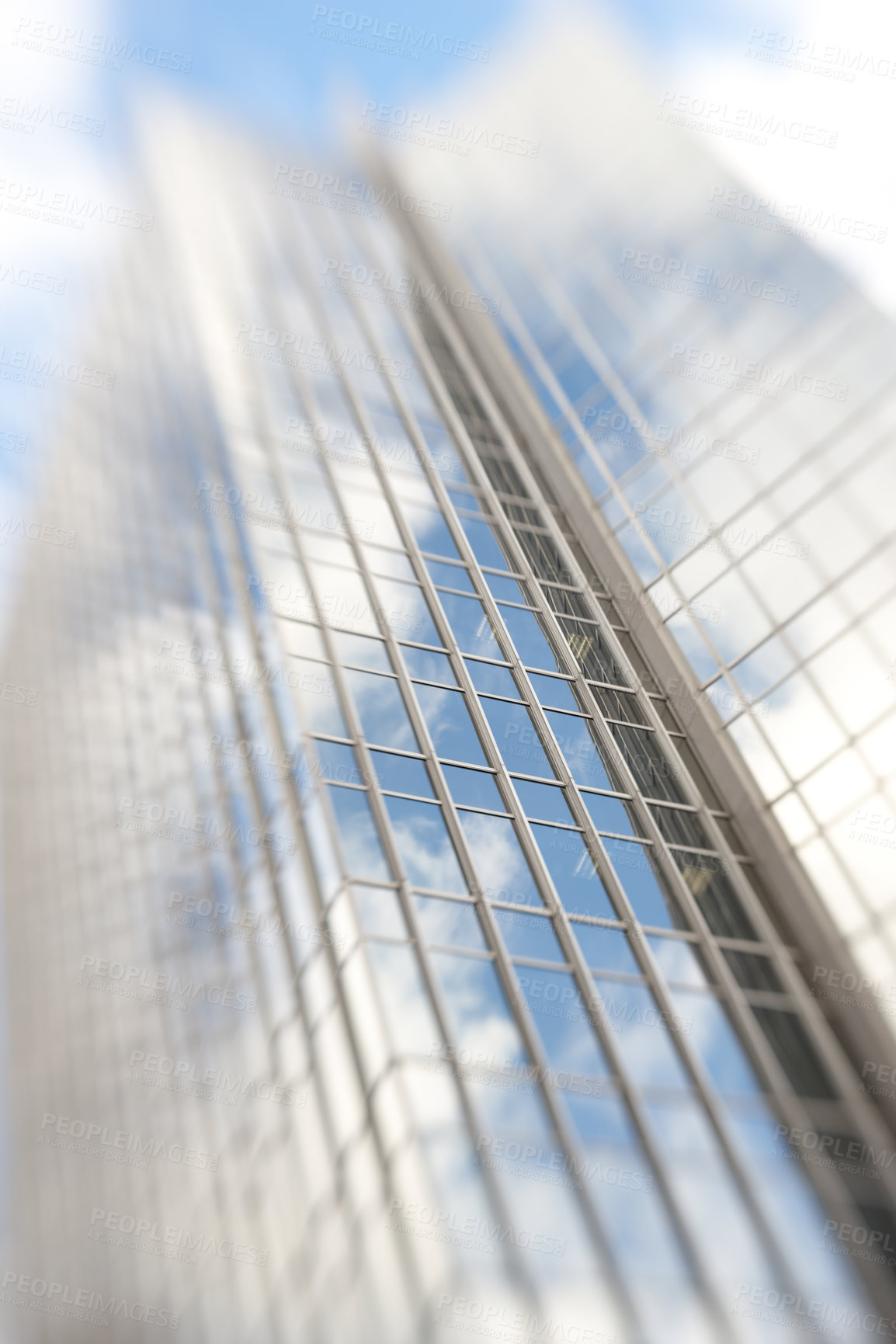 Buy stock photo Blurry, building and window of tower in city with reflection of blue sky and clouds on glass. Urban, office and architecture of skyscraper or hotel with trippy motion for vertigo from heights in town