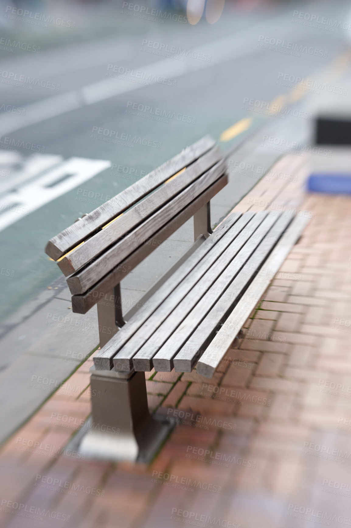 Buy stock photo Urban, bench and seat on sidewalk in city with blurry motion for vertigo or trippy dizziness. Wood, chair and sit on street with support of government infrastructure, development or town progress