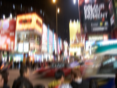 Buy stock photo Blur, city and people on road at night outdoor in New York cityscape for population migration with traffic. Busy crowd, motion and street with lights, walk and travel in urban society with buildings