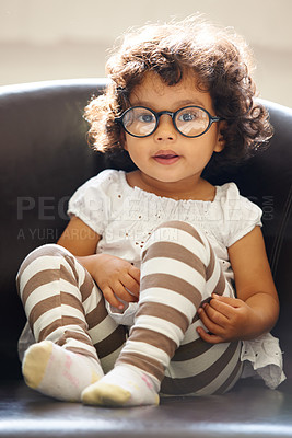 Buy stock photo Toddler, girl and portrait or glasses for play, learning childhood development or education growth. Female person, kid or face eyewear on home relax sofa for intelligent, knowledge or nerd spectacles