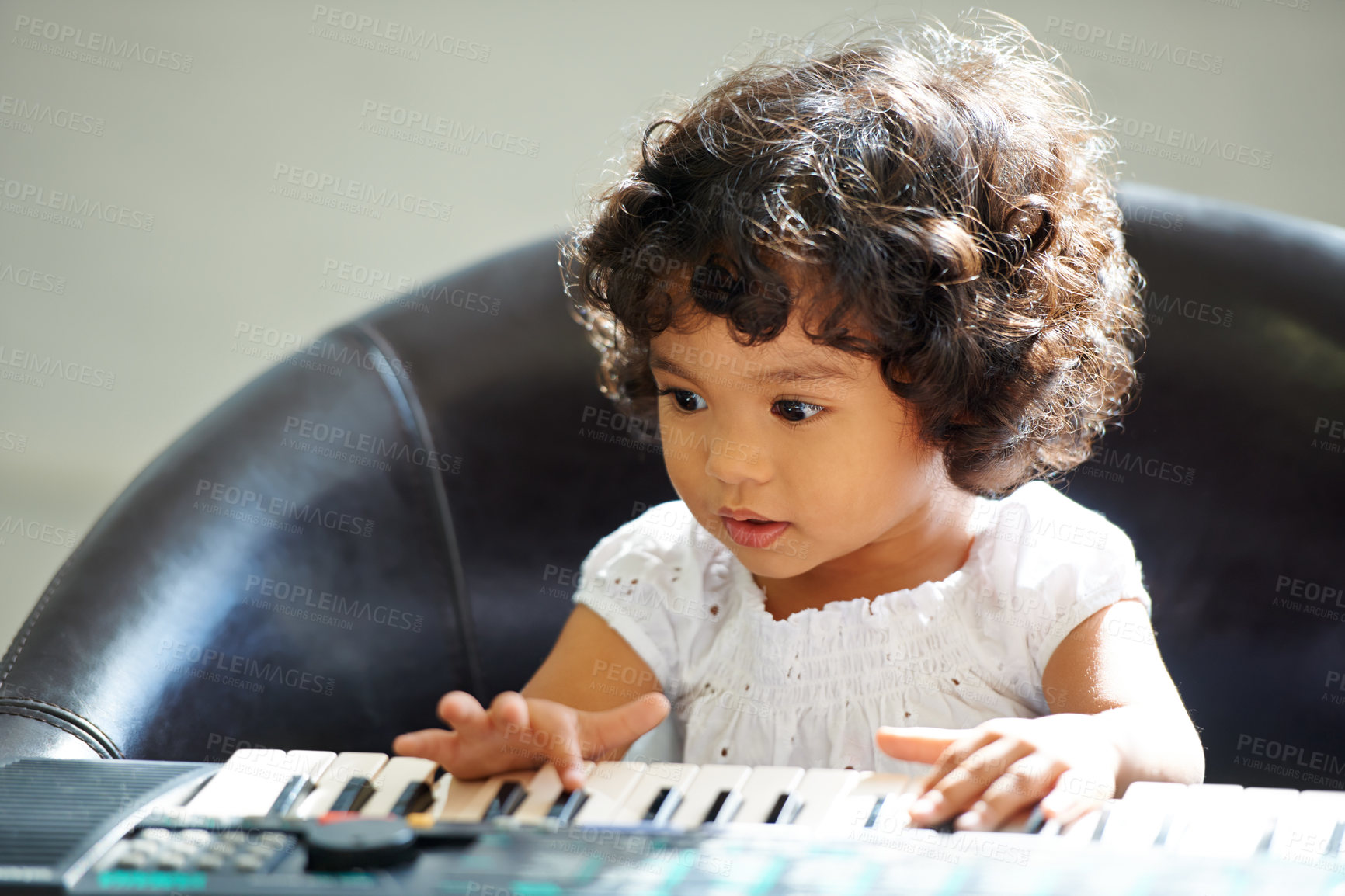 Buy stock photo Girl, child and keyboard music play for childhood learning, education development or lessons. Female person, kid and piano keys song or instrument training knowledge, youth artist or future musician