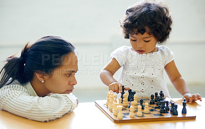 Buy stock photo A little girl playing chess