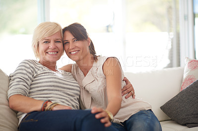 Buy stock photo Portrait of a lesbian couple relaxing at home