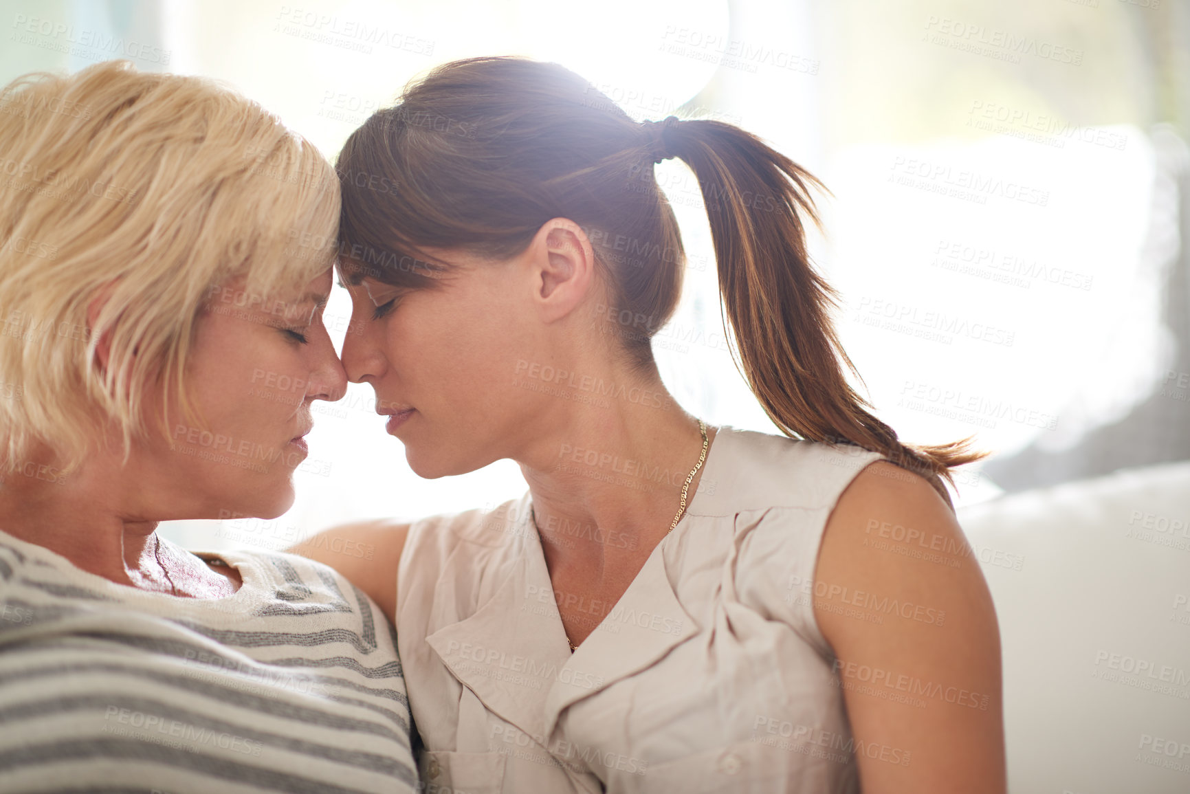 Buy stock photo Lesbian, couple and women with love at house for nose touch, marriage commitment or morning romance. People, lgbtq and relax with affection, bonding together and loyalty for relationship pride of hug