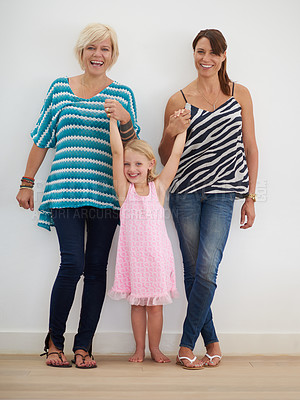 Buy stock photo Portrait, gay and family with child at house for adoption commitment, holding hands and relationship care. People, girl and relax for affection, bonding together and lesbian mothers with freedom