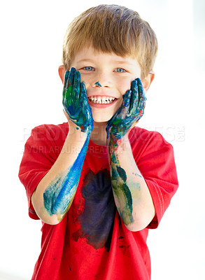 Buy stock photo Portrait, smile and paint with a creative boy in studio isolated on a white background for art or education. Face, hands and messy with a happy young child student touching his cheeks in excitement