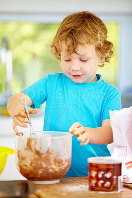 Buy stock photo Baking, child and learning in kitchen in home for development, education or make chocolate pastry. Young kid, food and mixing dough, flour and cooking at table for breakfast in the morning in house