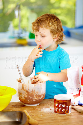 Buy stock photo Messy, boy or eating of chocolate to play, learn or child development as growth milestone idea. Male youth, lick or fingers as playful, naughty or nutrition in holiday wellness activity in kitchen