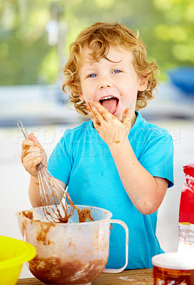 Buy stock photo Portrait, messy or boy as eating, chocolate or baking as fun, meal prep or holiday activity in home. Naughty, male child or whip to lick, dough or food mixture by learning, nutrition or wellness