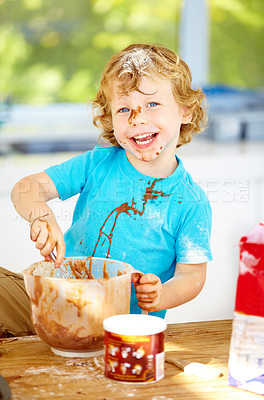 Buy stock photo Messy, boy or bowl in mixing, baking or playful meal prep as learning, activity or child development. Young male person, smile or ingredients on kitchen counter as fun, leisure or portrait at home