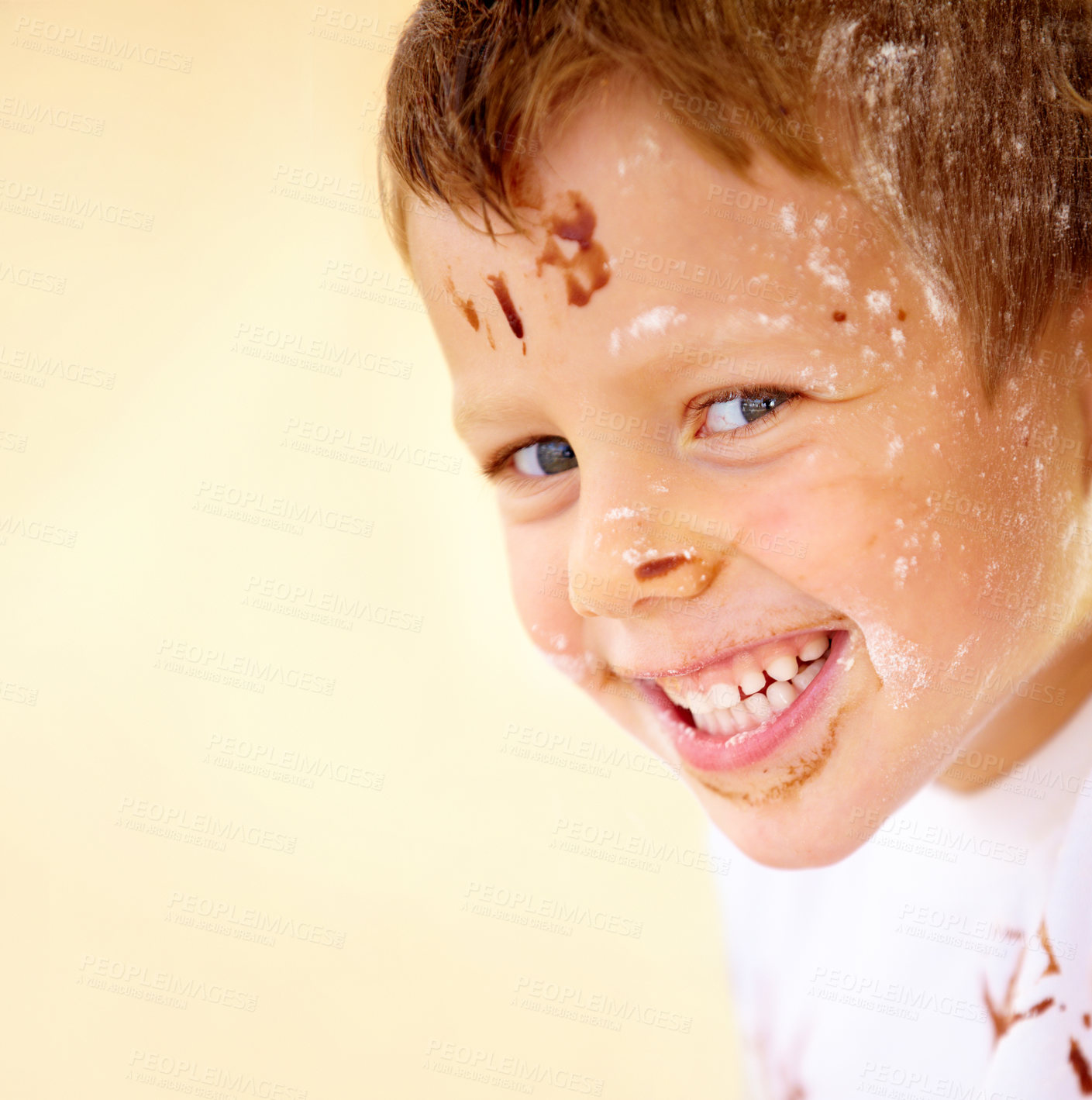 Buy stock photo Portrait, happy and flour with a boy in the kitchen of his home, learning how to bake for child development. Children, smile and cooking with a young kid looking naughty with ingredients on his face