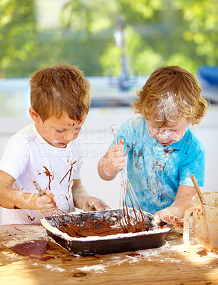 Buy stock photo Baking, kids and messy friends in the kitchen together, having fun with ingredients while cooking. Children, food and bake with naughty young brother siblings making a mess on a counter in their home