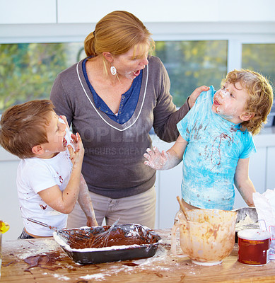 Buy stock photo Two boys being scolded by their mother for messing up her kitchen
