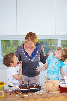 Buy stock photo Family, baking and a mother yelling at her children for the mess in a home kitchen with naughty boys. Food, cake or ingredients with a woman scolding her kids while cooking in an untidy apartment