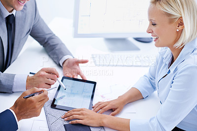 Buy stock photo Shot of a smiling businesswoman meeting with colleagues using a digital tablet