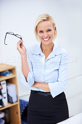 Buy stock photo Portrait of a confident businesswoman holding her glasses