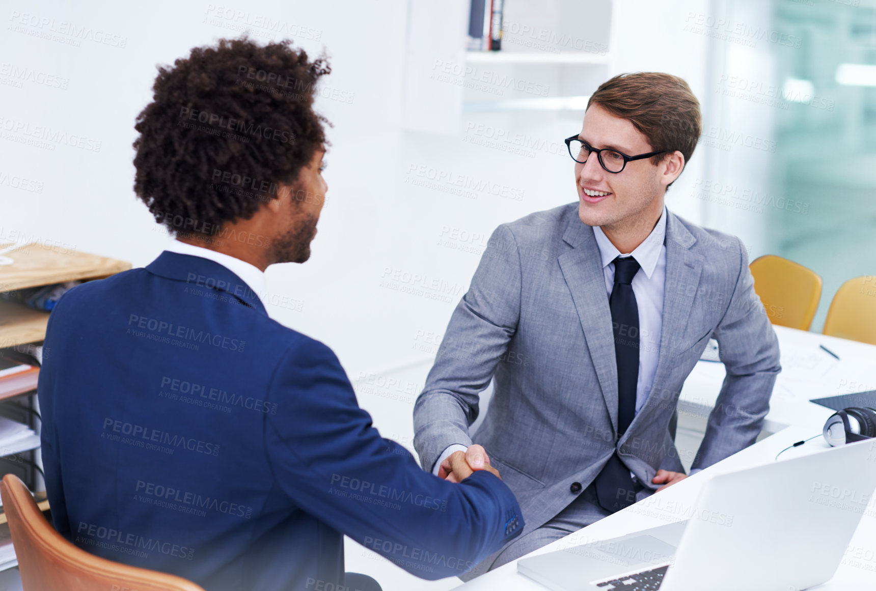 Buy stock photo Business people, handshake and meeting with laptop for partnership, agreement or teamwork at office. Businessman shaking hands with colleague for b2b, collaboration or hiring together at workplace