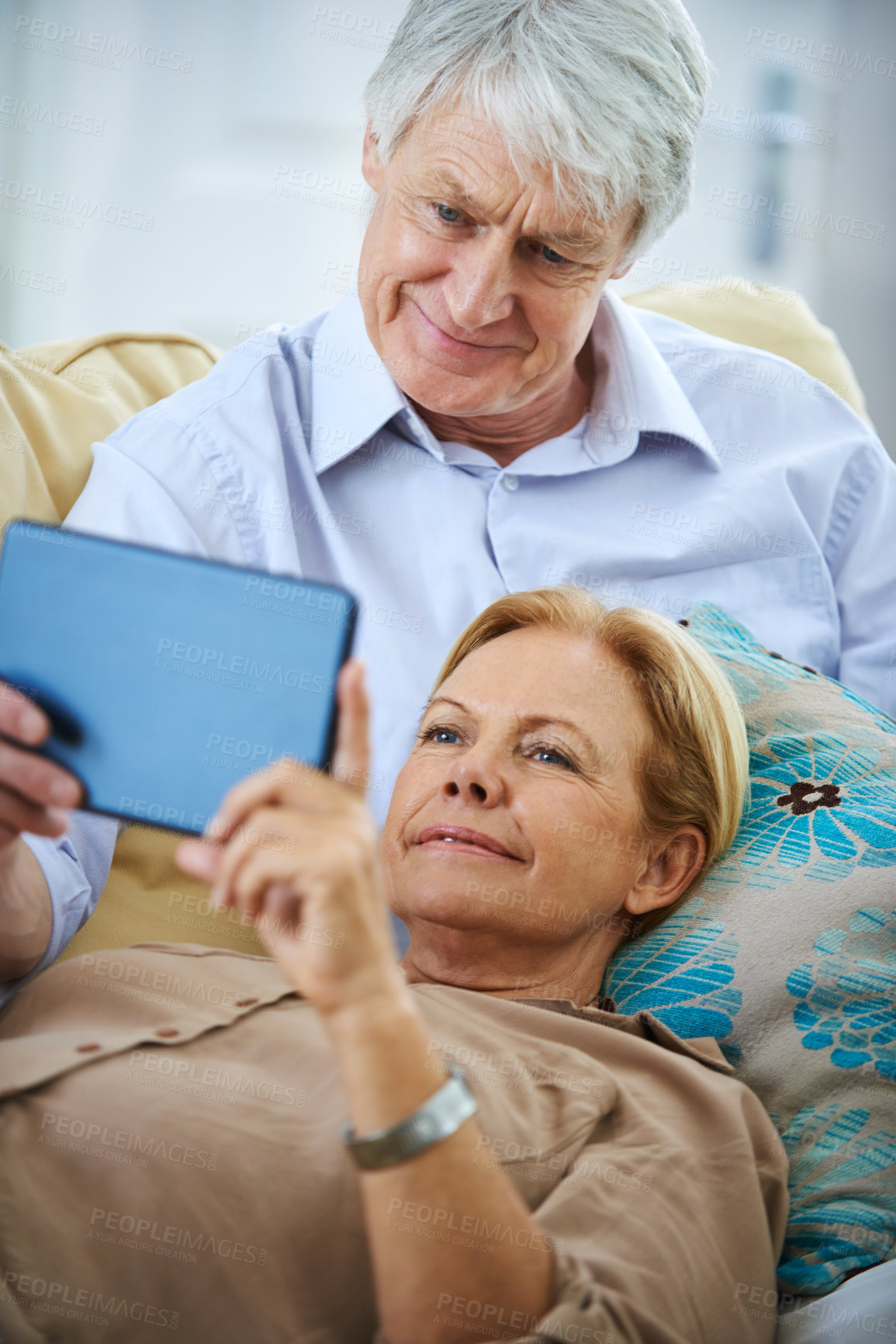 Buy stock photo Old couple, tablet and streaming to relax in home, watching movie and retirement bonding on sofa. Senior people, online subscription and website for blog on weekend, comfort and peace in marriage