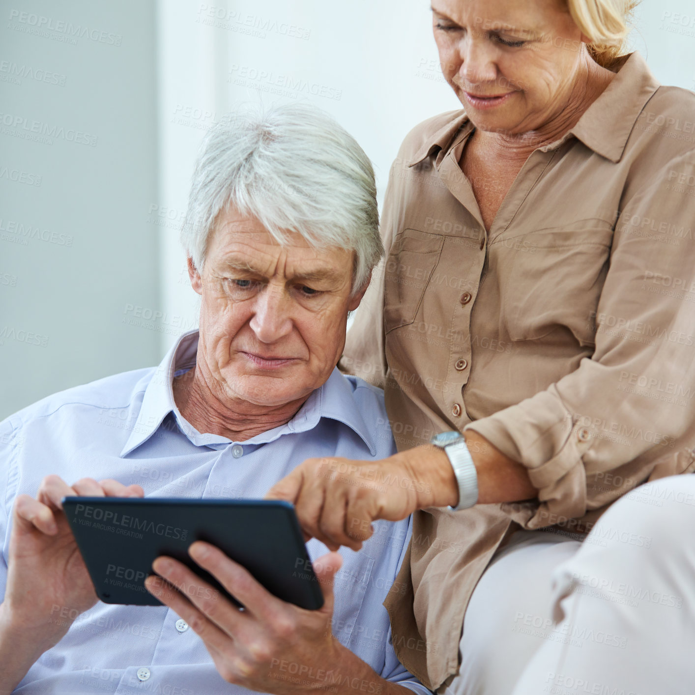 Buy stock photo Concern, frown and tablet with senior couple on sofa in living room of home together for internet lag. Confused, connection or worry with elderly man and woman in apartment for retirement browsing