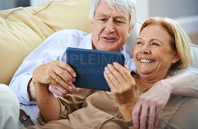 Buy stock photo House, tablet and old couple on sofa, funny and conversation with internet, smile or retirement. Comedy, senior man or mature woman with tech, network or digital app for online video and joke