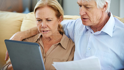 Buy stock photo Old couple, paper and tablet for finance in home, planning and asset management in retirement. Senior people, banking website and review savings account, talking and documents for tax application