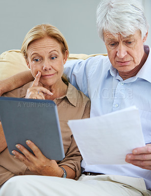 Buy stock photo Old couple, planning and tablet for finance in home, thinking and asset management in retirement. Senior people, banking website and review savings account, solution and documents for tax application