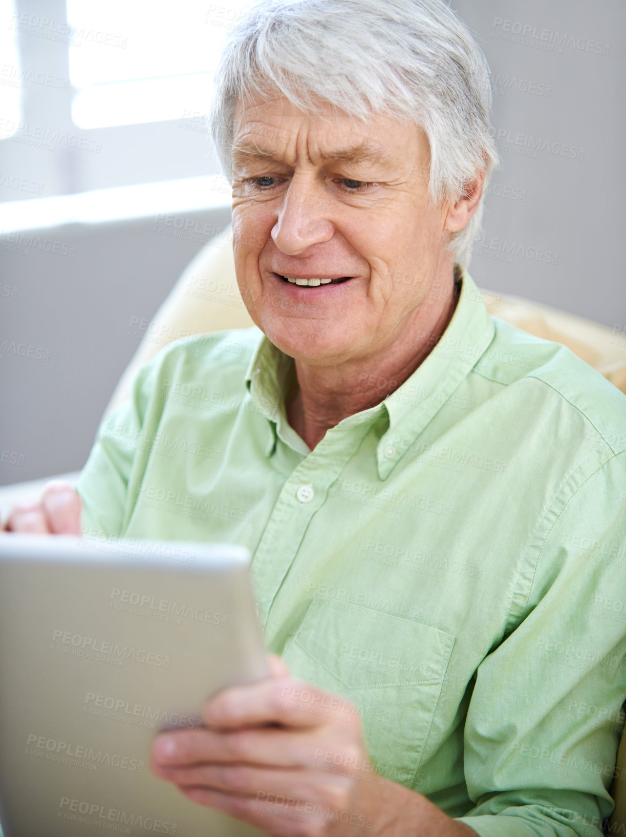 Buy stock photo Tablet, relax and senior man in home on internet for social media, website and online entertainment. Retirement, happy and elderly person on digital tech for search, reading news and connection