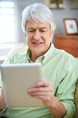 Buy stock photo Tablet, video call and senior man in home on internet for social media, website and online networking. Retirement, relax and elderly person on digital tech for talking, communication and connection