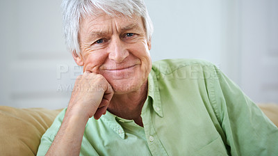 Buy stock photo Portrait of a happy elderly man feeling positive and smiling at home. Senior retired male relaxing on the sofa while resting and staying in a retirement home. Friendly senior man looking joyful