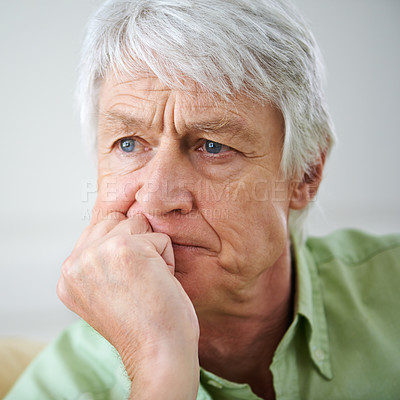 Buy stock photo Sad, thinking and old man on sofa in home with memory, stress and retirement anxiety in lounge. Mental health, worry and senior person on couch in with nostalgia, Alzheimer or dementia in apartment