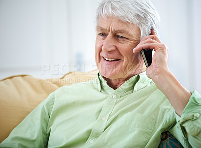 Buy stock photo Phone call, happy and senior man in home for communication, contact and conversation. Retirement, relax and elderly person on cellphone for talking, online chatting and speaking in living room