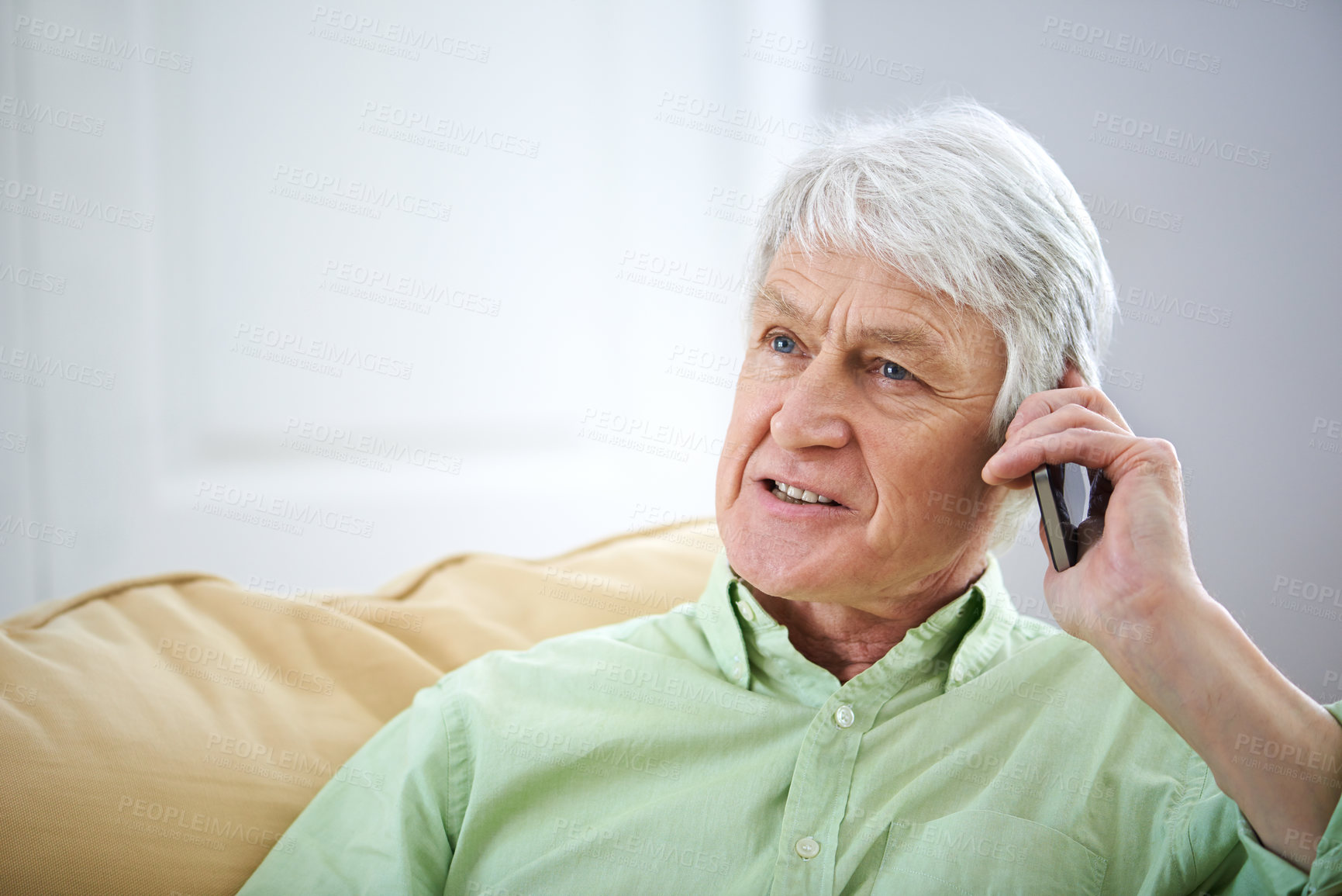 Buy stock photo Phone call, relax and senior man in home for communication, contact and conversation. Retirement, happy and elderly person on cellphone for talking, online chatting and speaking in living room